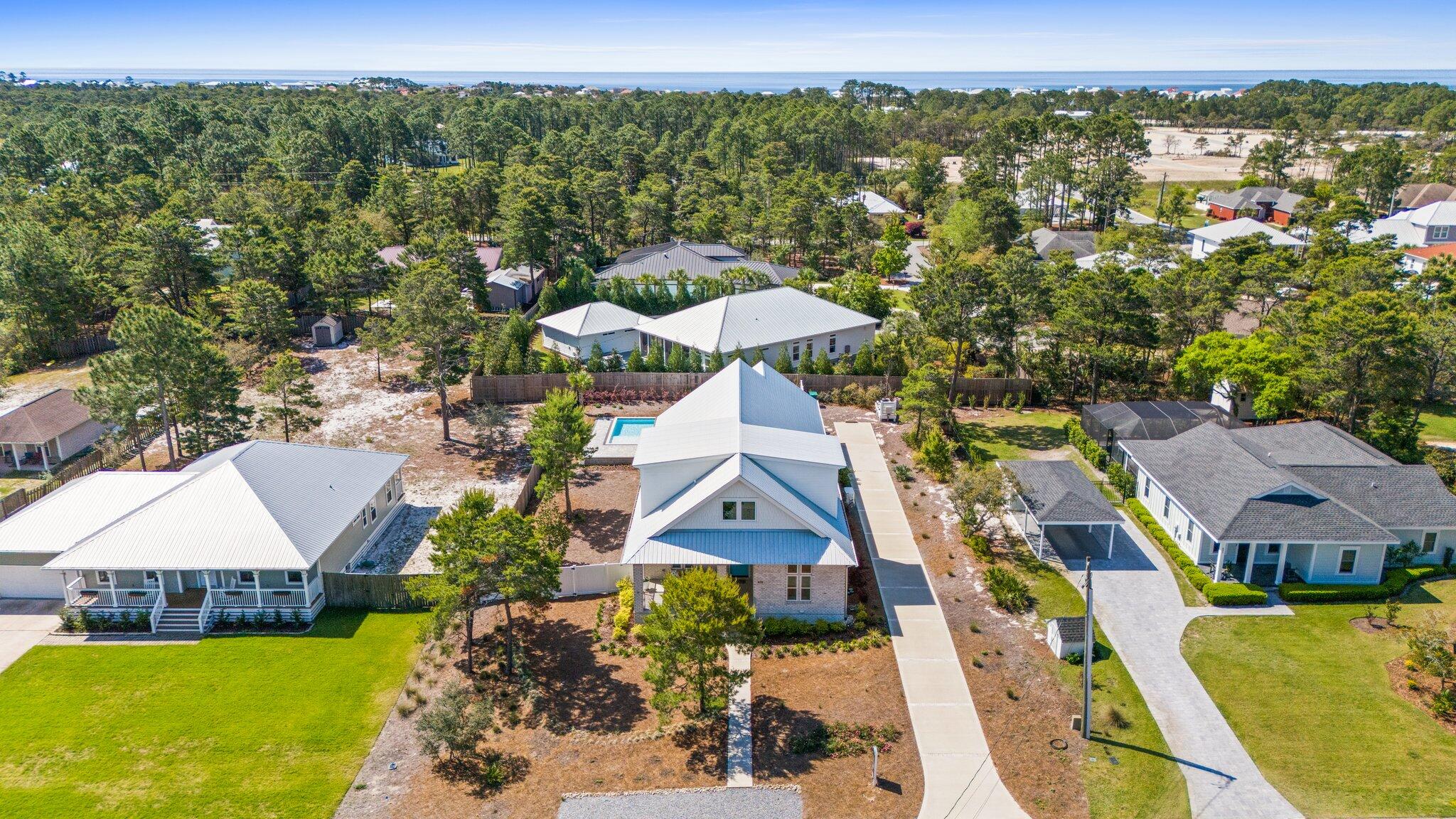 479 Ridge Road Santa Rosa Beach, FL 32459 - Photo 43 of 46 an aerial view of residential houses with outdoor space and swimming pool