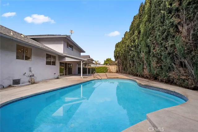 a view of a swimming pool with an outdoor seating