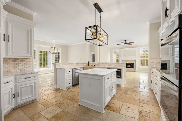 a kitchen with a stove top oven sink and cabinets