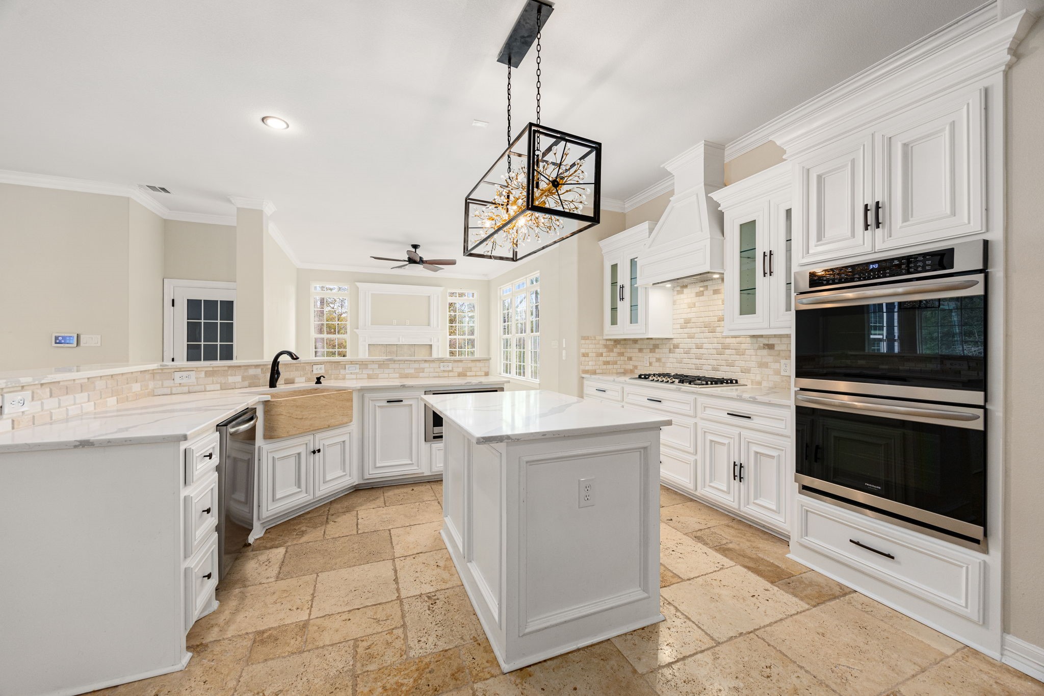 14882 Gingham Road Montgomery, TX 77356 - Photo 20 of 50 a kitchen with white cabinets and appliances