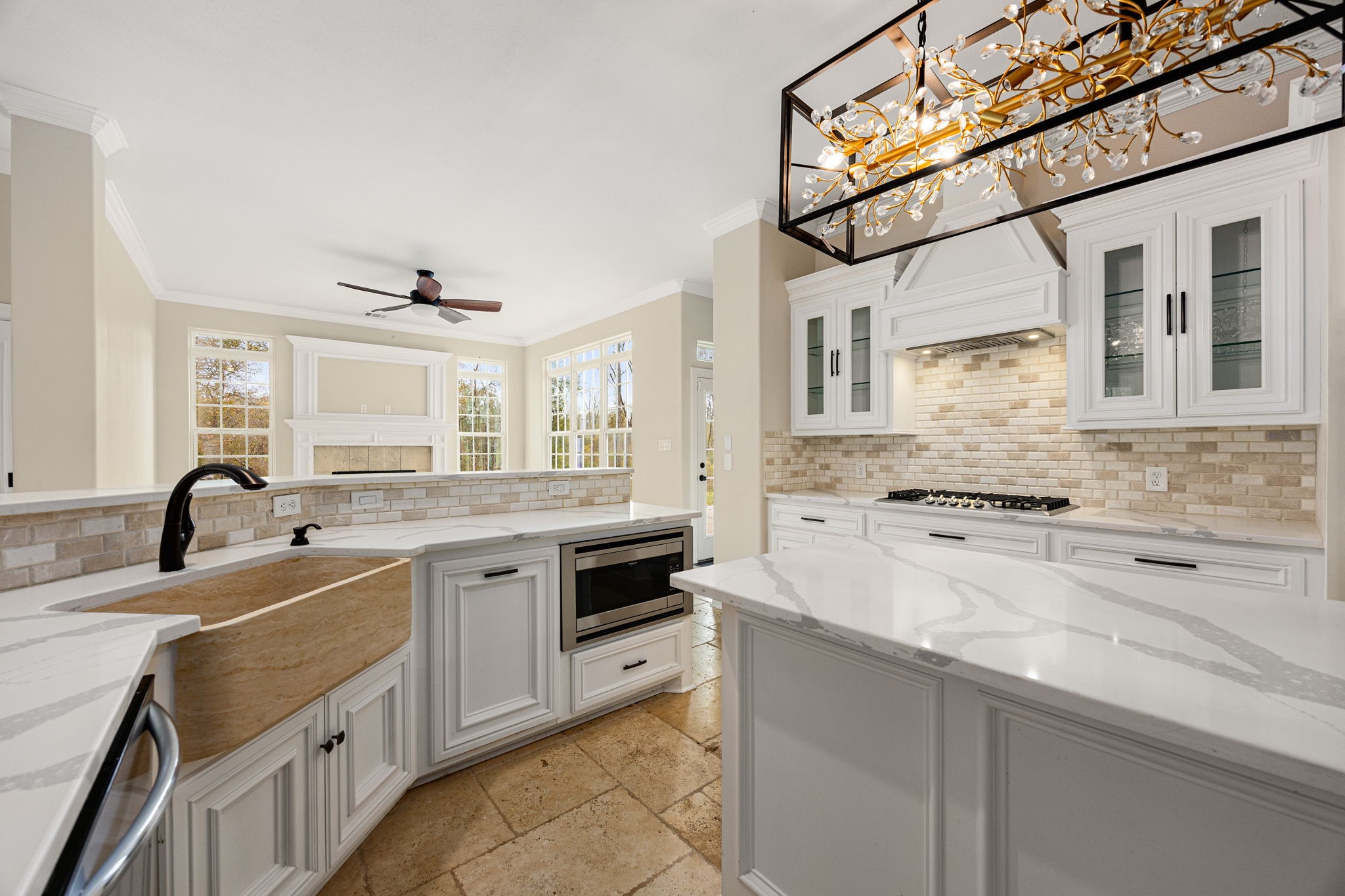 14882 Gingham Road Montgomery, TX 77356 - Photo 21 of 50 a kitchen with a sink stove and cabinets