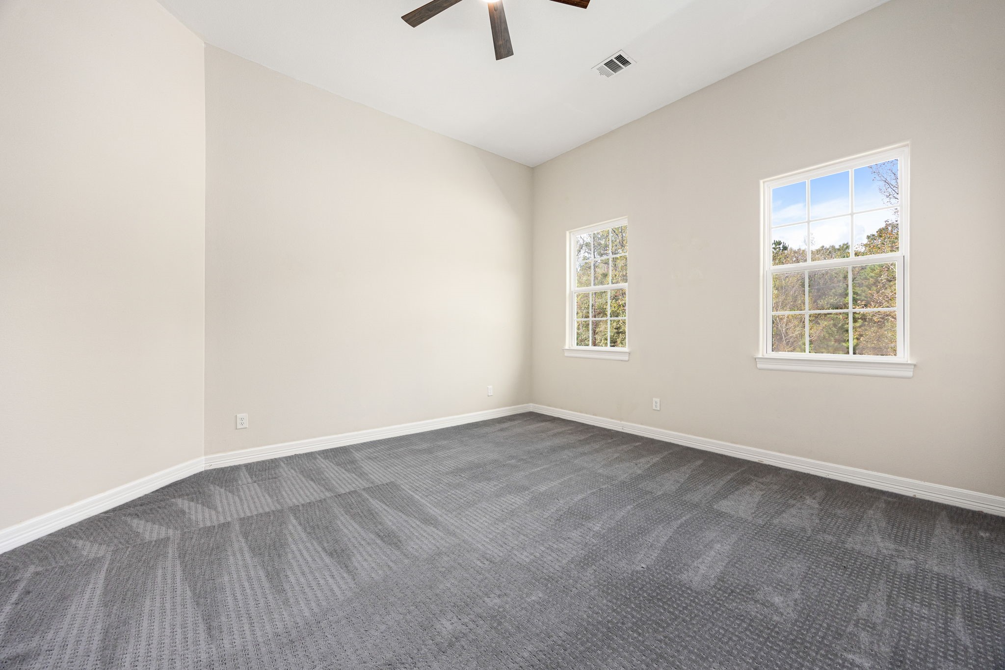 14882 Gingham Road Montgomery, TX 77356 - Photo 43 of 50 an empty room with a window and a ceiling fan