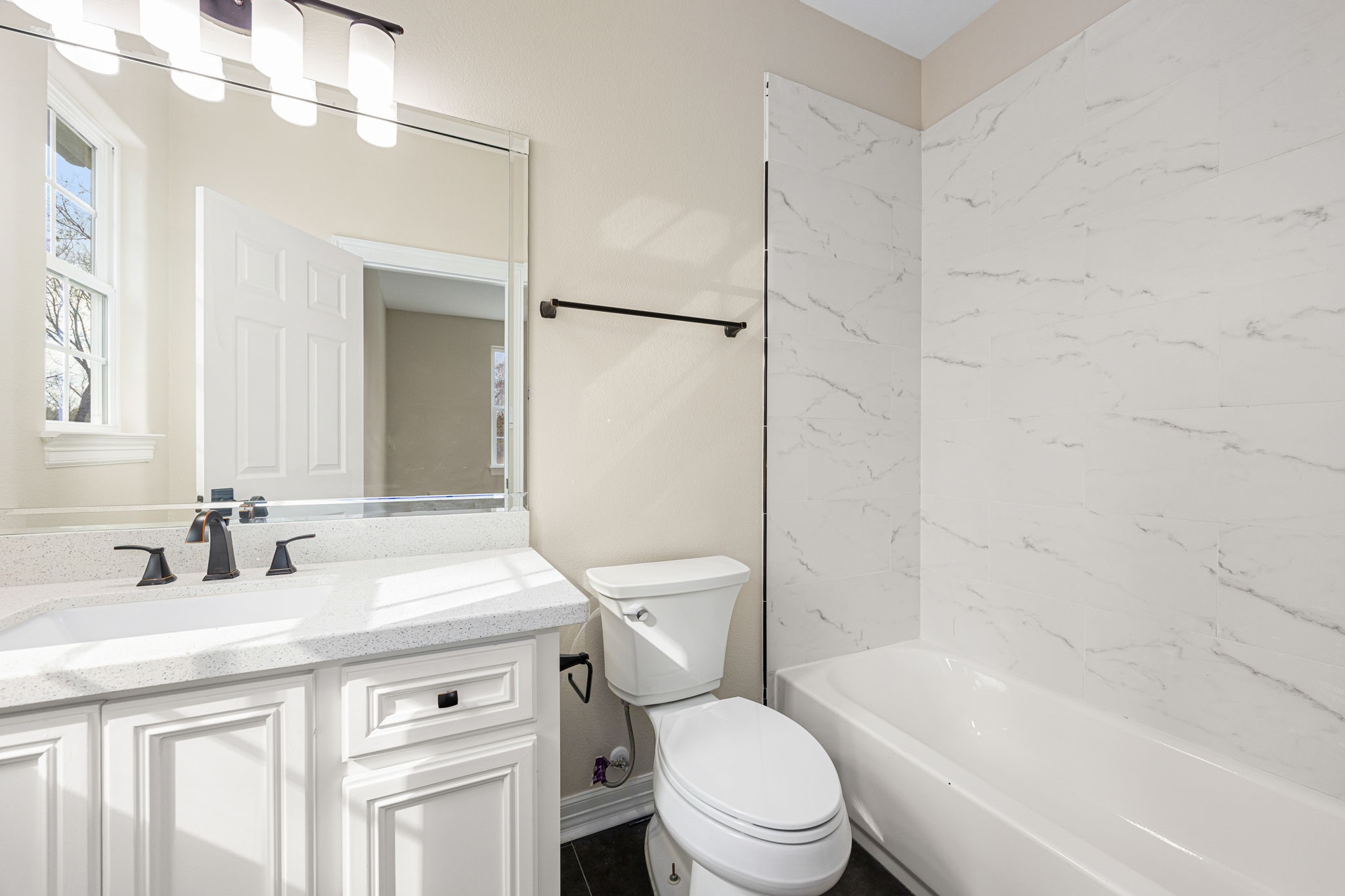 14882 Gingham Road Montgomery, TX 77356 - Photo 44 of 50 a bathroom with a granite countertop sink toilet mirror and shower