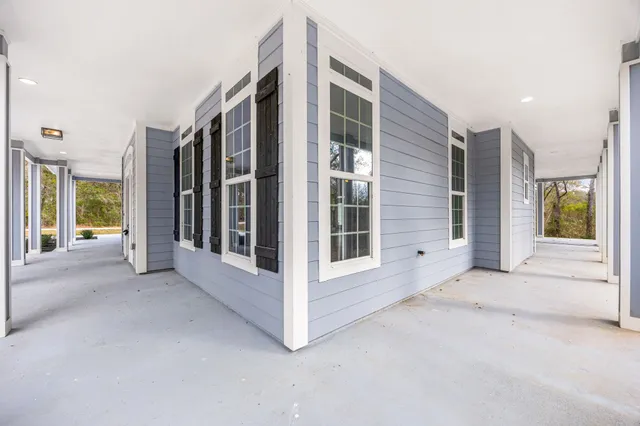 a view of a big room with windows