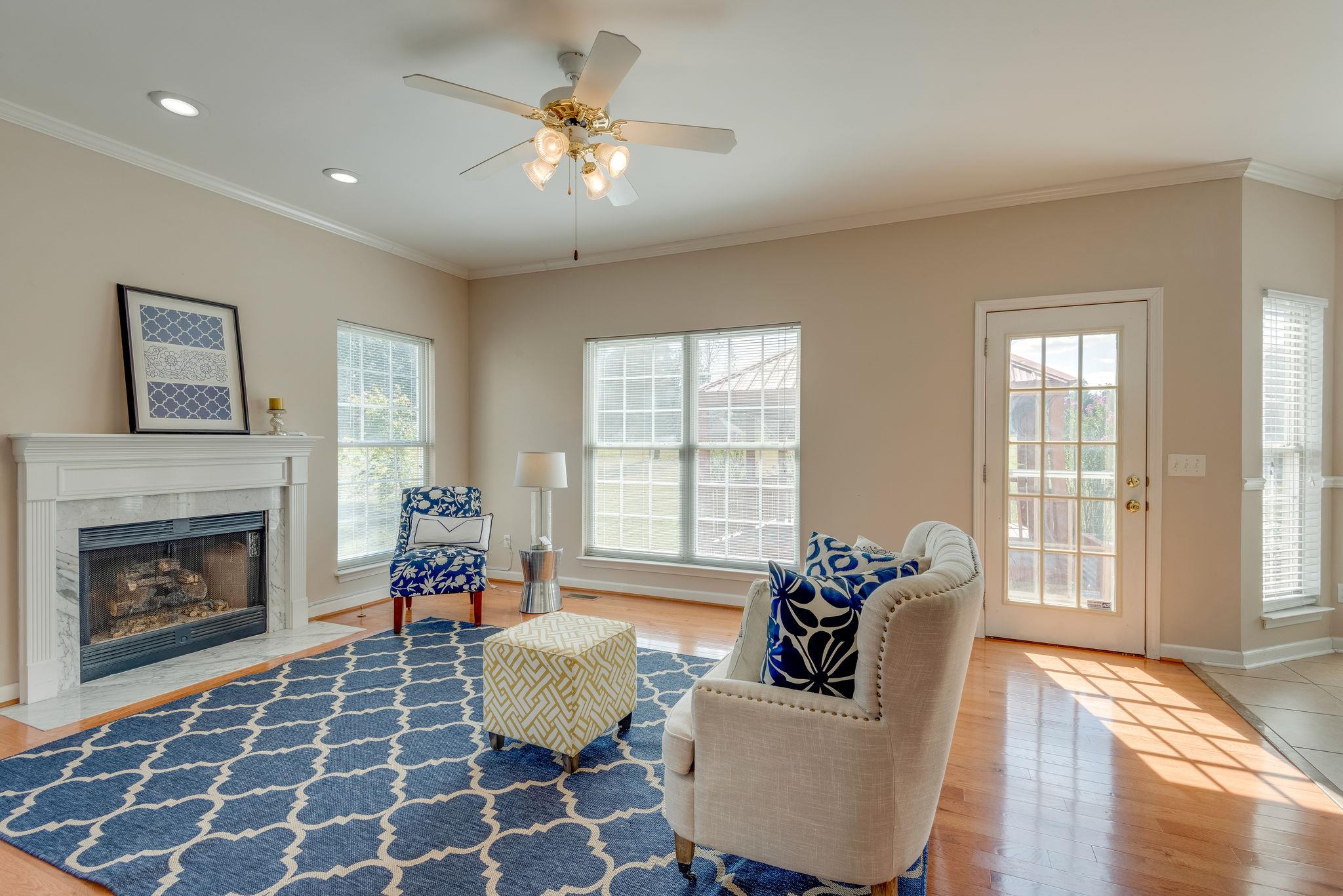 269 Eastside Road Burns, TN 37029 - Photo 11 of 22 a living room with furniture and a fireplace