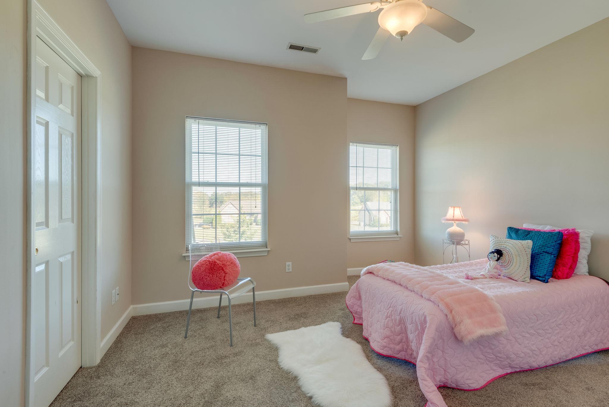 269 Eastside Road Burns, TN 37029 - Photo 20 of 22 a bedroom with a bed and chandelier