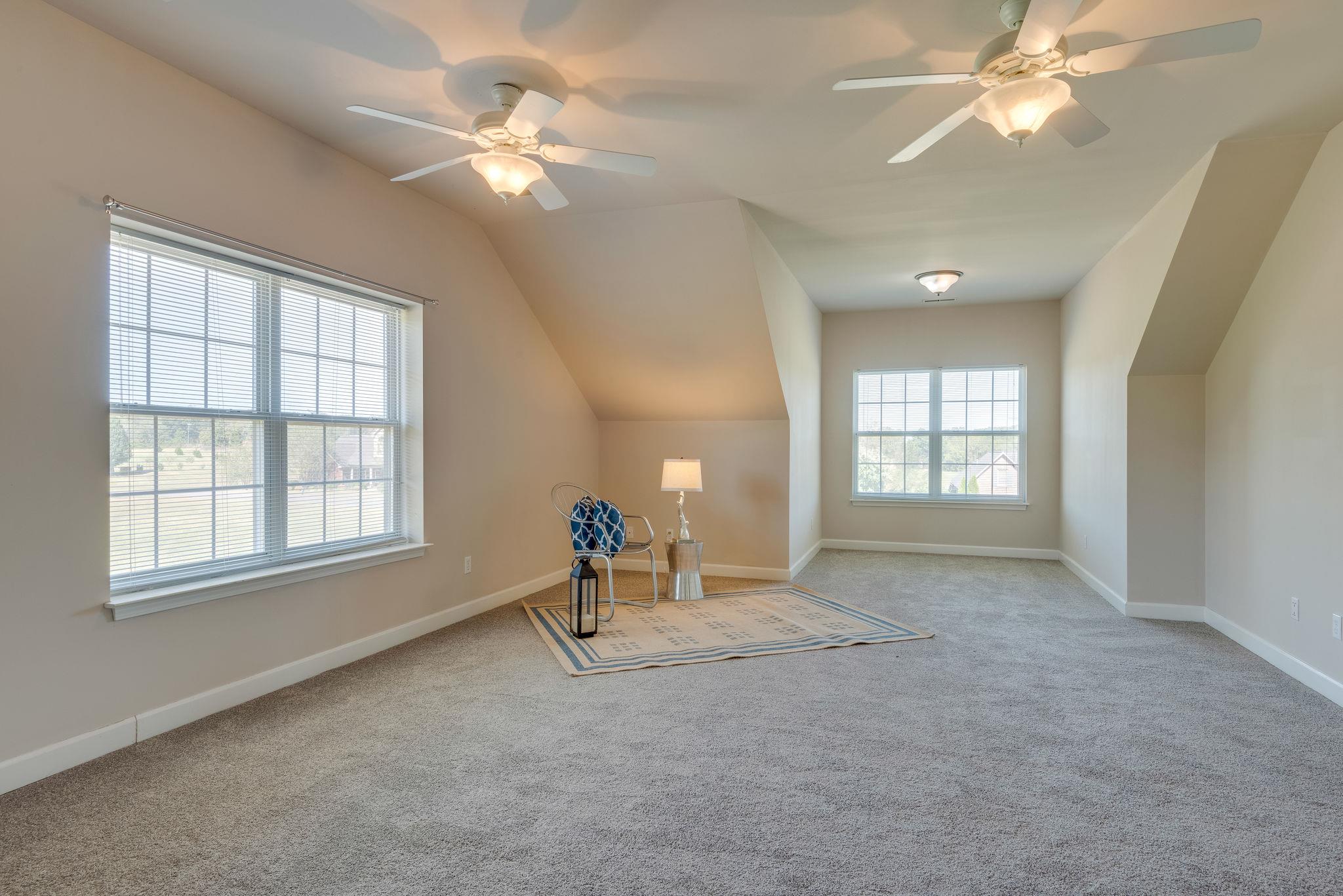269 Eastside Road Burns, TN 37029 - Photo 22 of 22 a view of a livingroom with a ceiling fan and window