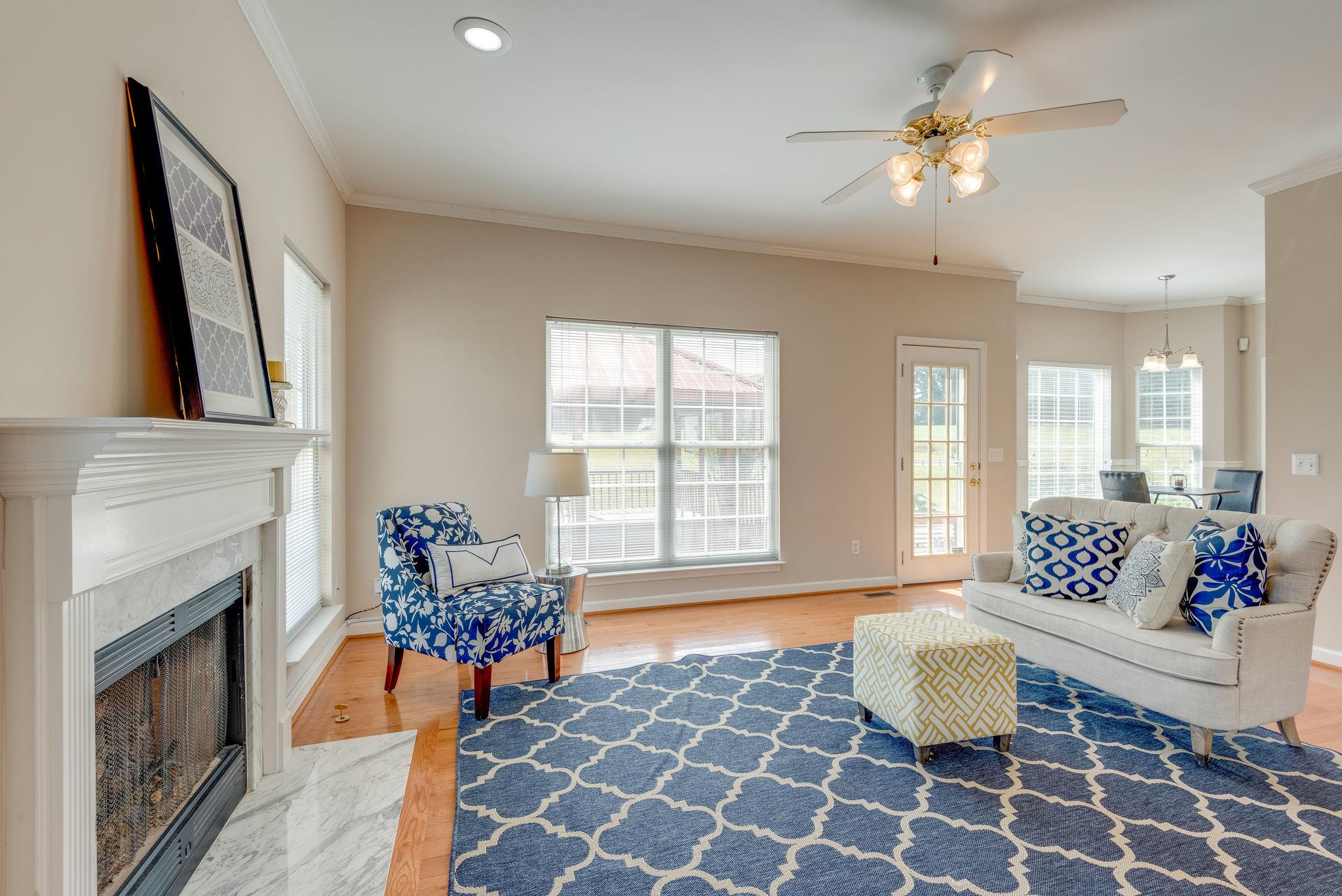 269 Eastside Road Burns, TN 37029 - Photo 10 of 22 a living room with furniture a fireplace and a flat screen tv