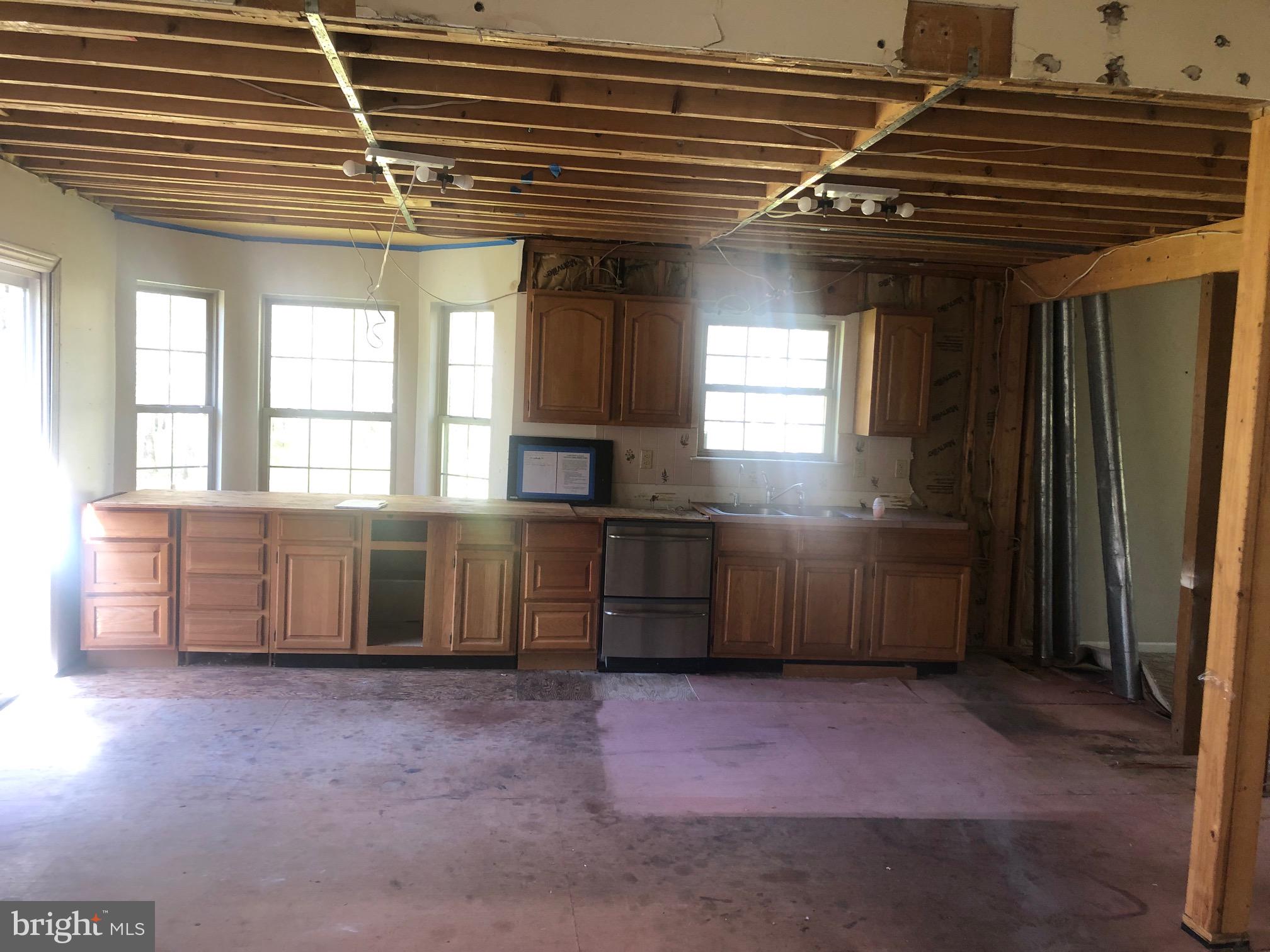 458 Weymouth Road Buena, NJ 08310 - Photo 3 of 12 a kitchen with kitchen island a sink a stove and a refrigerator