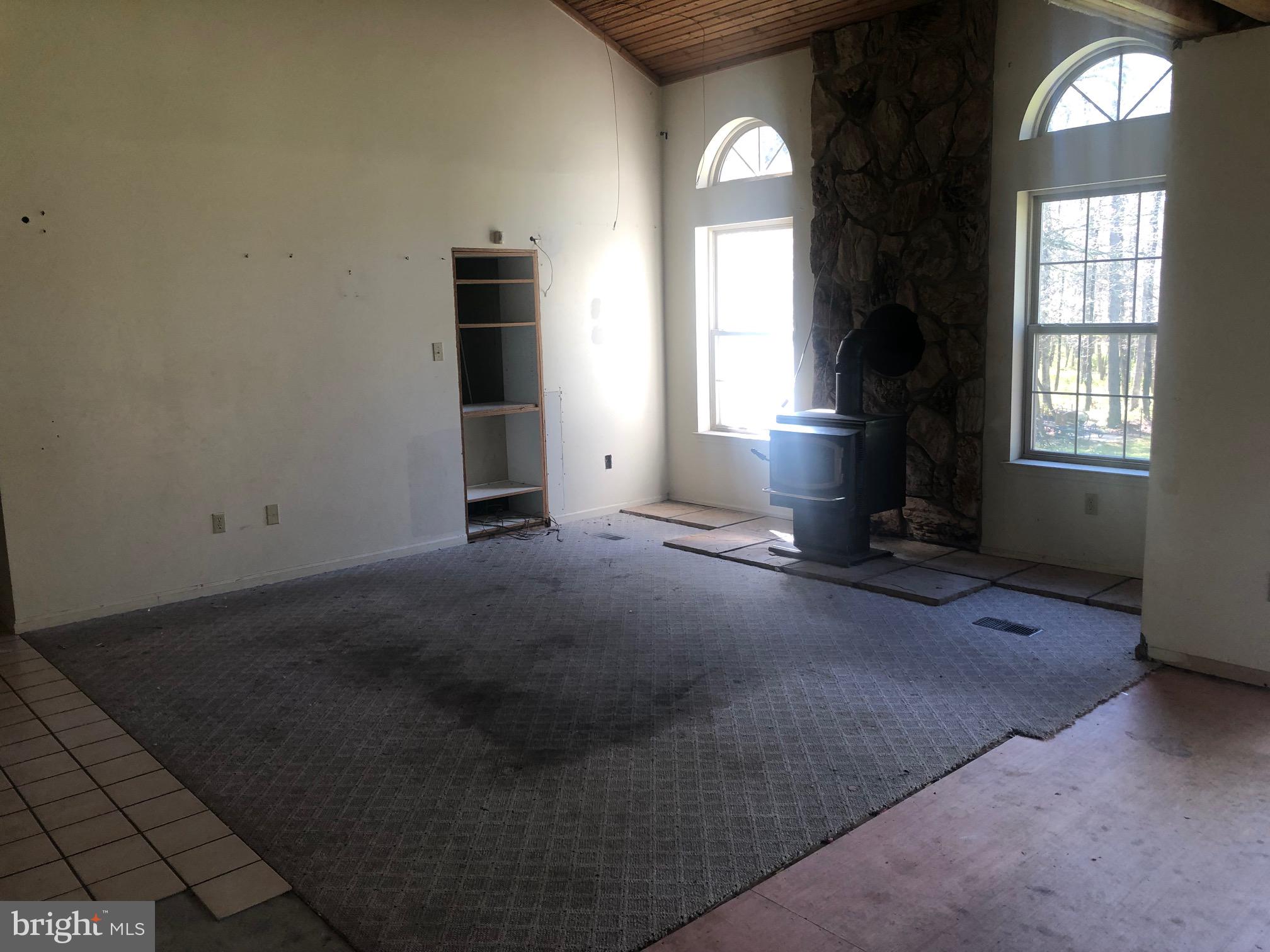 458 Weymouth Road Buena, NJ 08310 - Photo 4 of 12 an empty room with windows