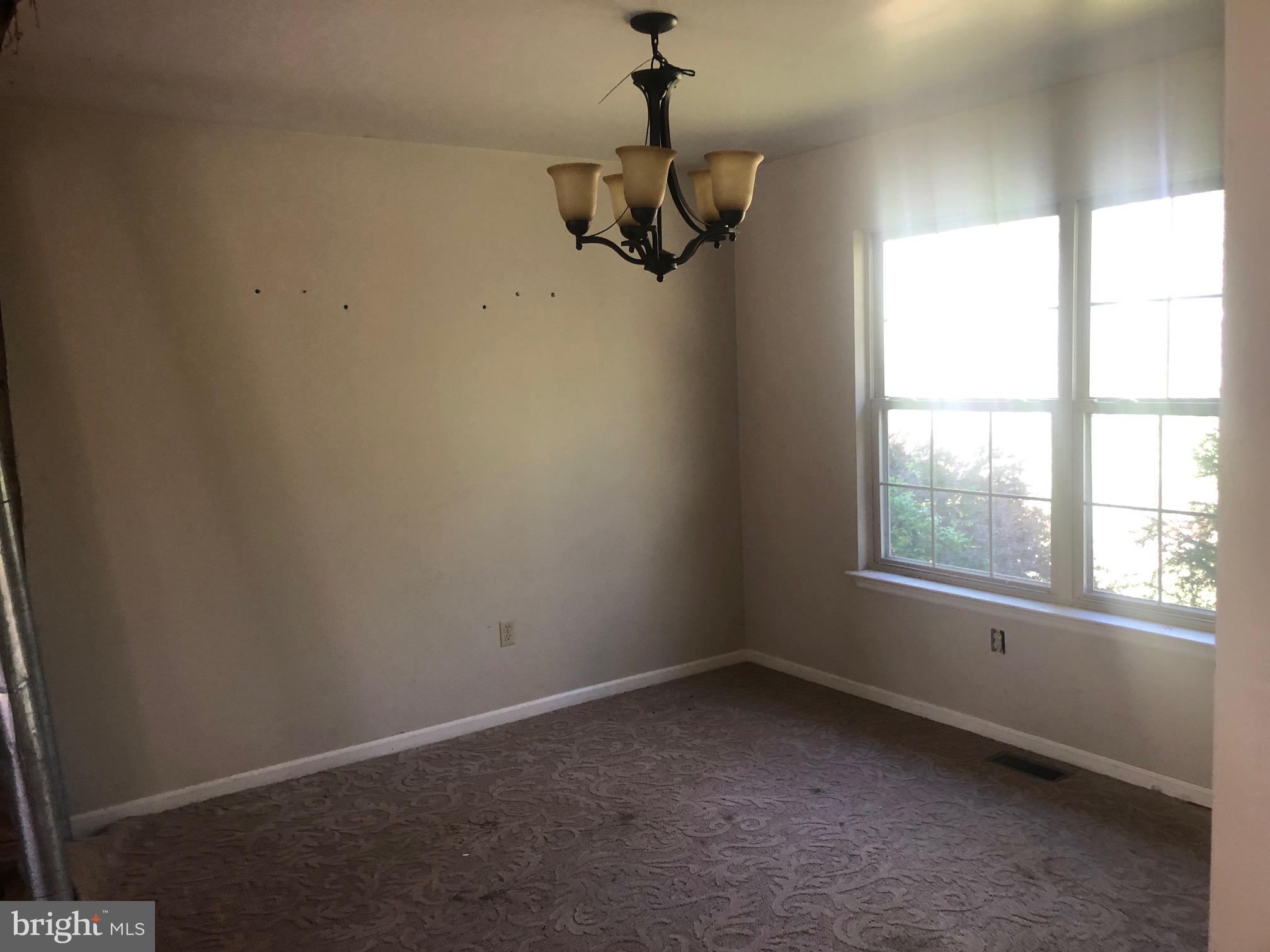 458 Weymouth Road Buena, NJ 08310 - Photo 5 of 12 an empty room with windows