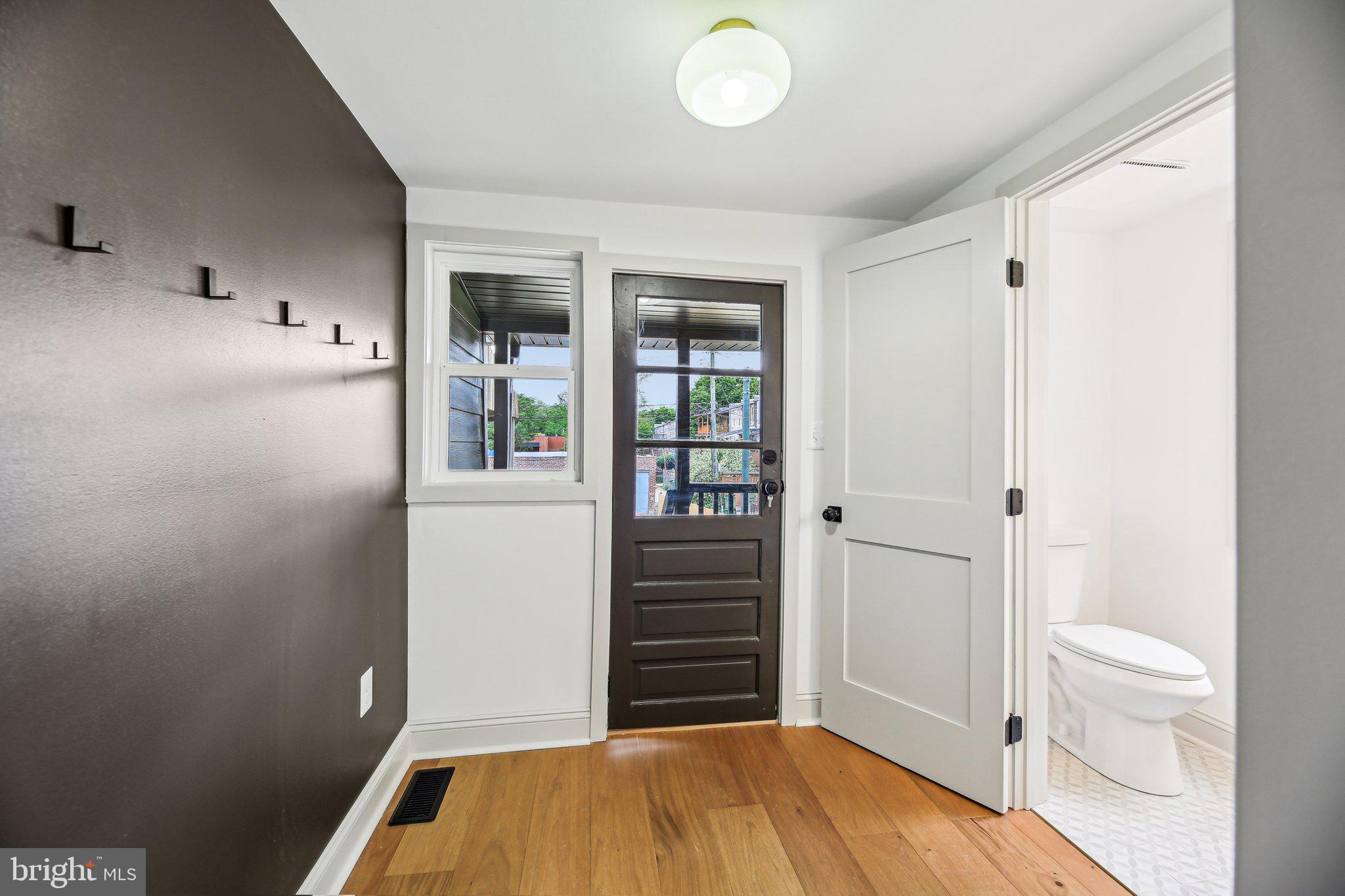 3348 Chestnut Avenue Baltimore, MD 21211 - Photo 16 of 39 a bedroom with a bed and a bathroom