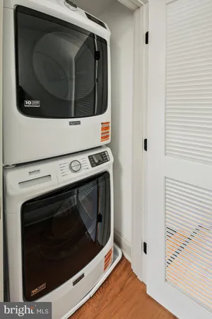 a bedroom with a bed and a night stand