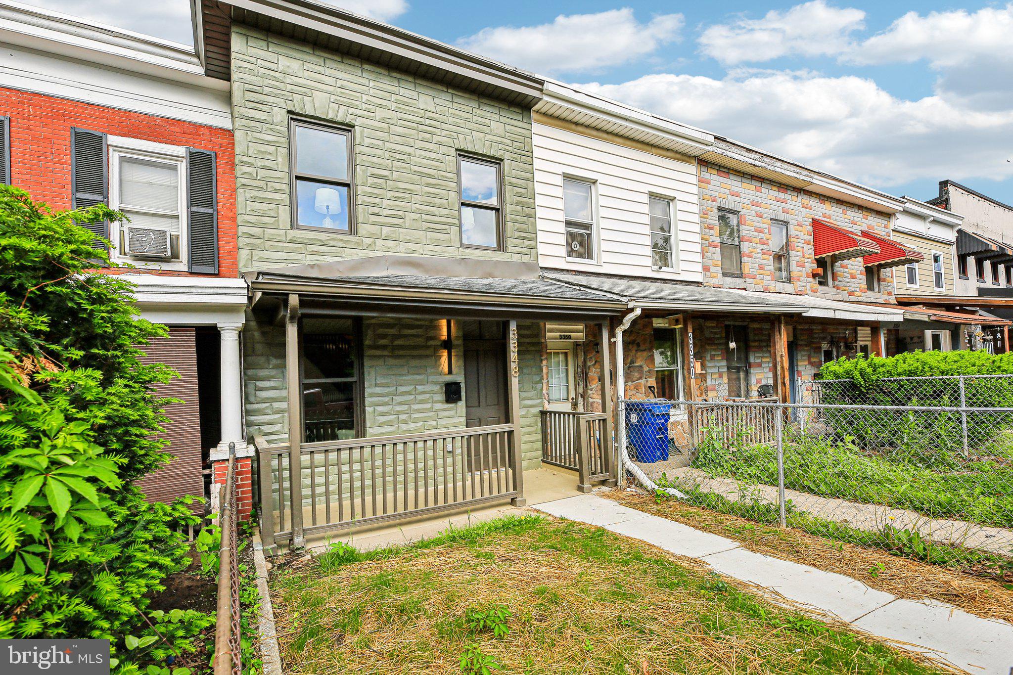 3348 Chestnut Avenue Baltimore, MD 21211 - Photo 2 of 39 front view of a building with a porch