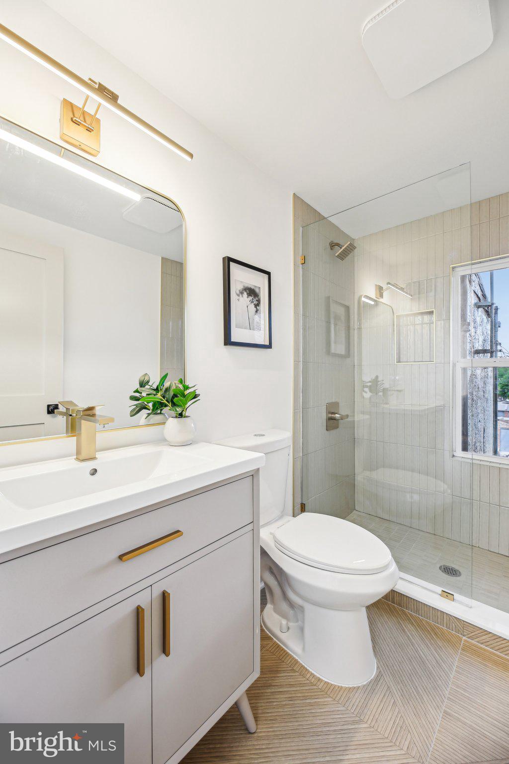 3348 Chestnut Avenue Baltimore, MD 21211 - Photo 23 of 39 a bathroom with a sink a toilet and shower