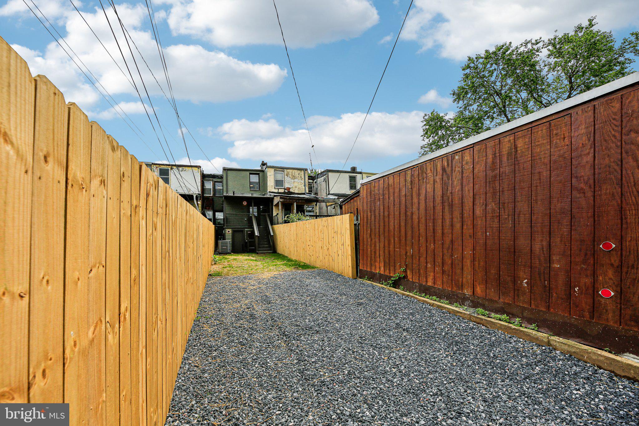 3348 Chestnut Avenue Baltimore, MD 21211 - Photo 38 of 39 a view of a backyard with wooden fence