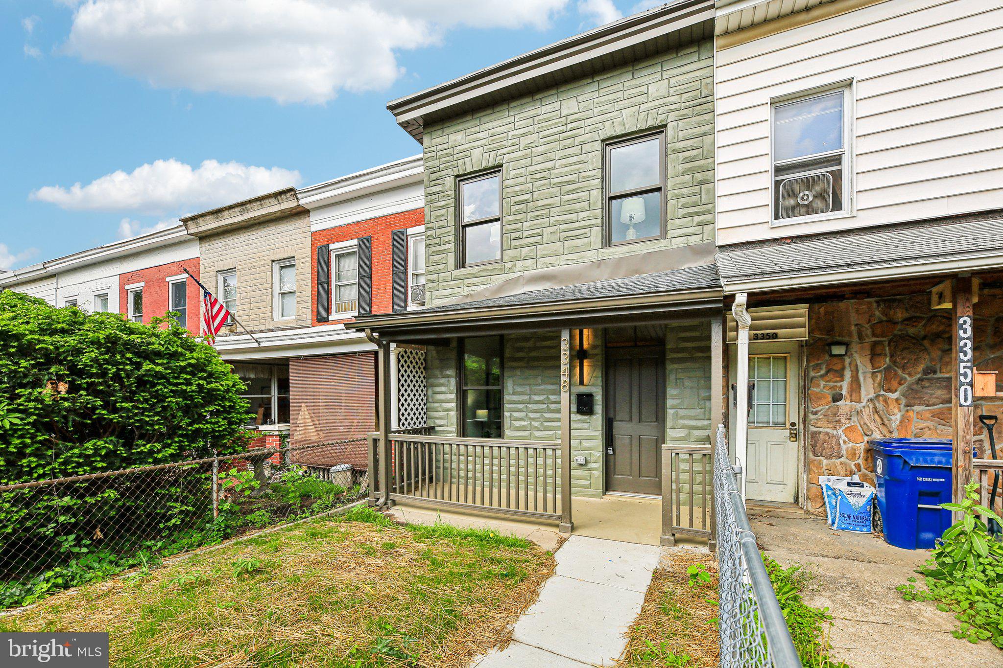 3348 Chestnut Avenue Baltimore, MD 21211 - Photo 4 of 39 a front view of a house with a yard