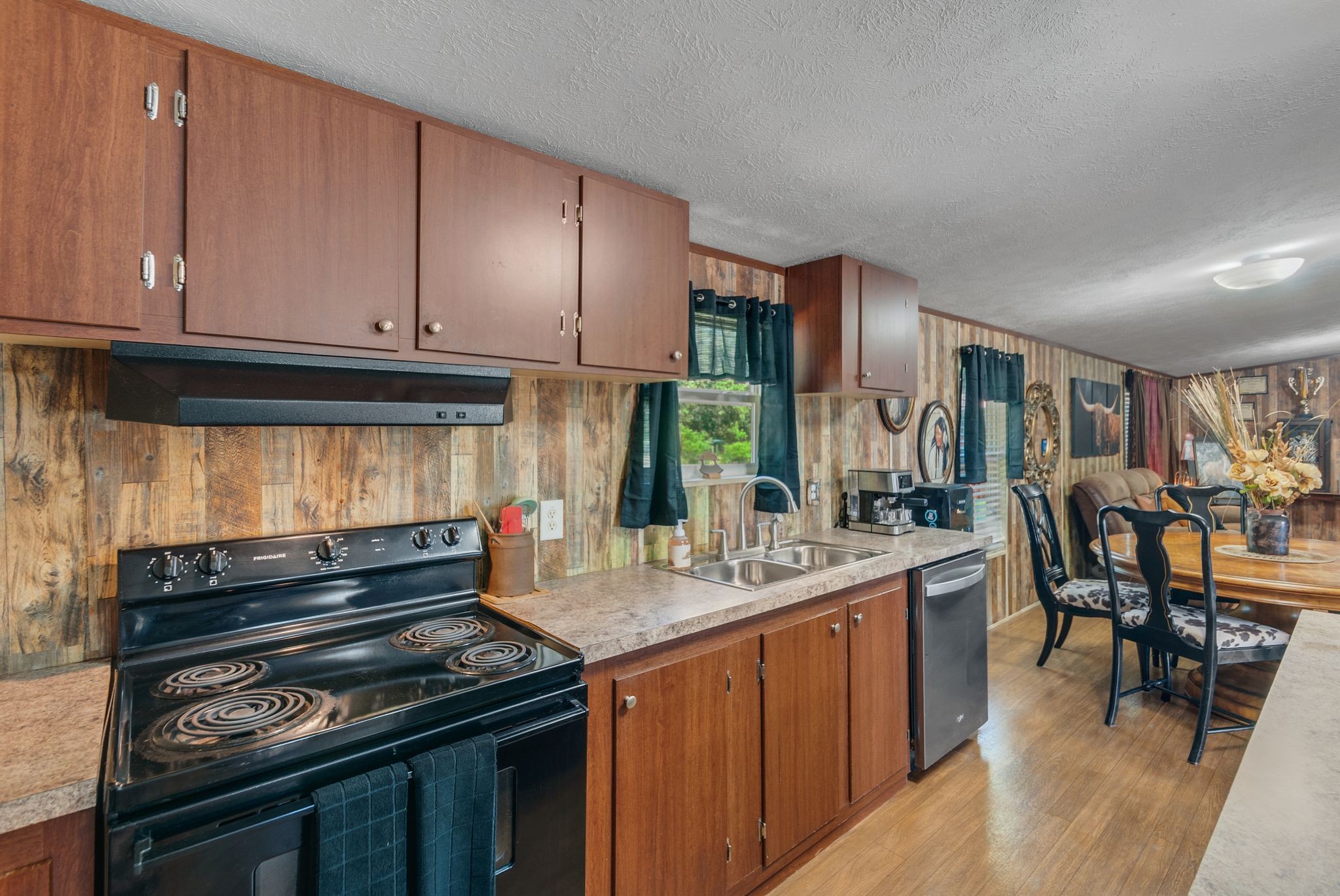 54 Shelton Road Fayetteville, TN 37334 - Photo 27 of 65 a kitchen with stainless steel appliances granite countertop a stove a sink and a microwave