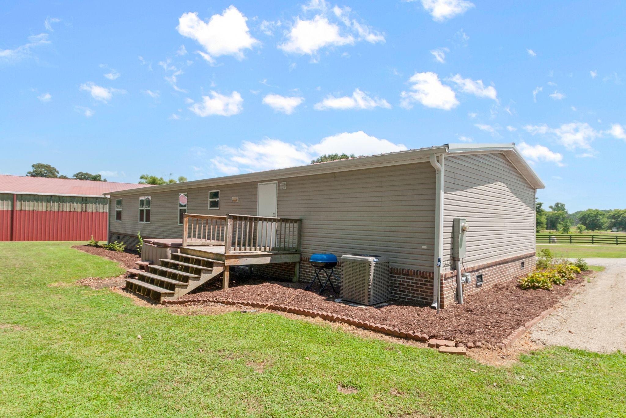 54 Shelton Road Fayetteville, TN 37334 - Photo 47 of 65 a backyard of a house with table and chairs
