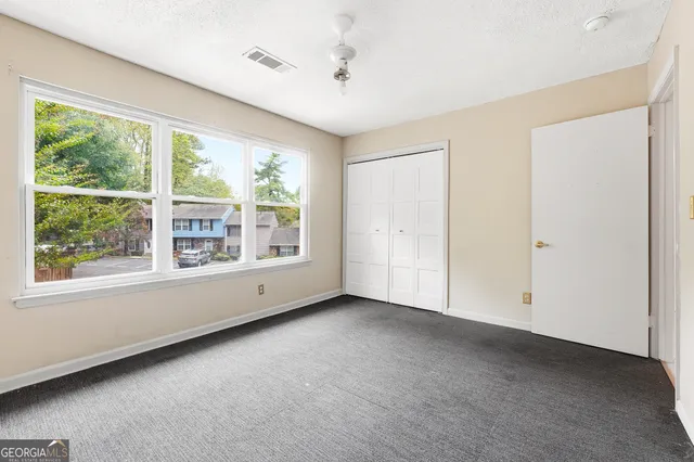 a view of an empty room with a window