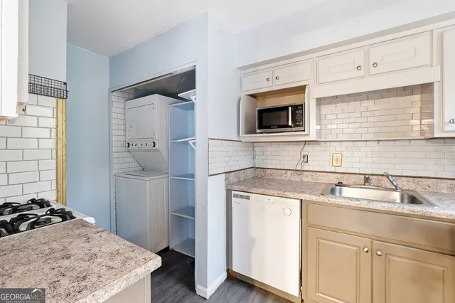 a kitchen with a stove and a sink