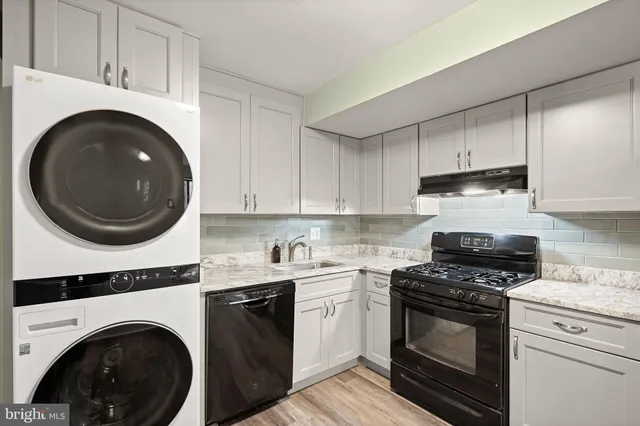 a spacious bedroom with a bed and a window
