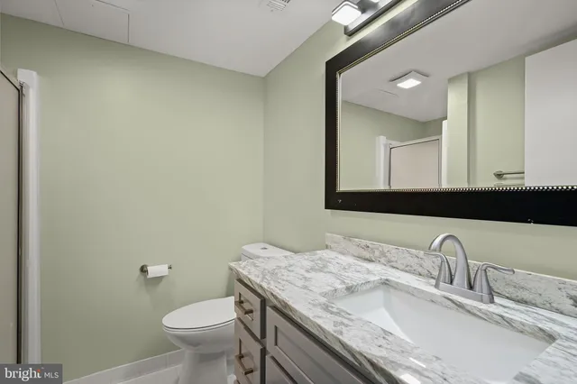 a bathroom with a glass shower door