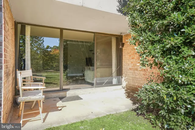 a view of backyard with outdoor seating