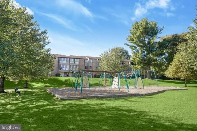 a view of a grassy field with trees