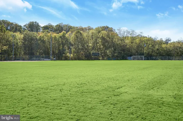 a view of a lake with houses in the back