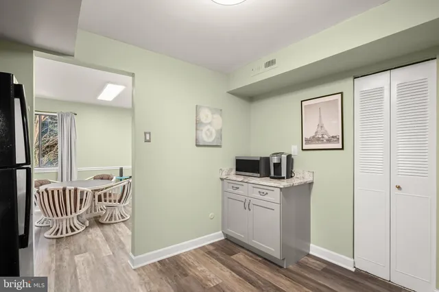 a kitchen with granite countertop stainless steel appliances and wooden cabinets