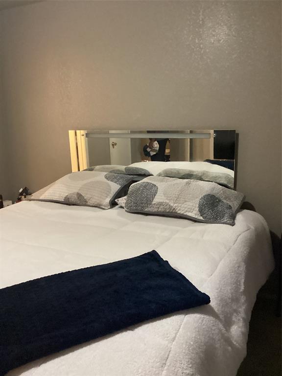 2003 Leath Street Dallas, TX 75212 - Photo 14 of 23 a bedroom with a bed and a night stand