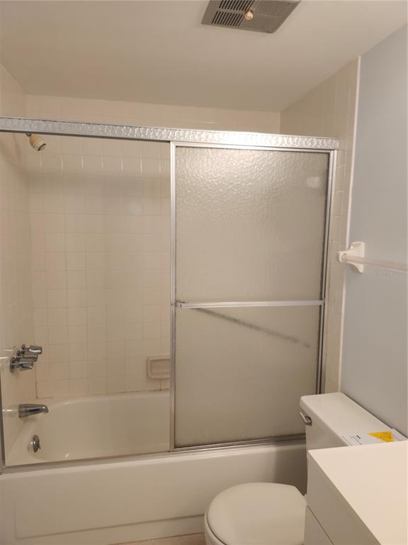 1515 Forrest Nelson Boulevard, Unit J104 Port Charlotte, FL 33952 - Photo 13 of 27 a bathroom with a shower and a toilet