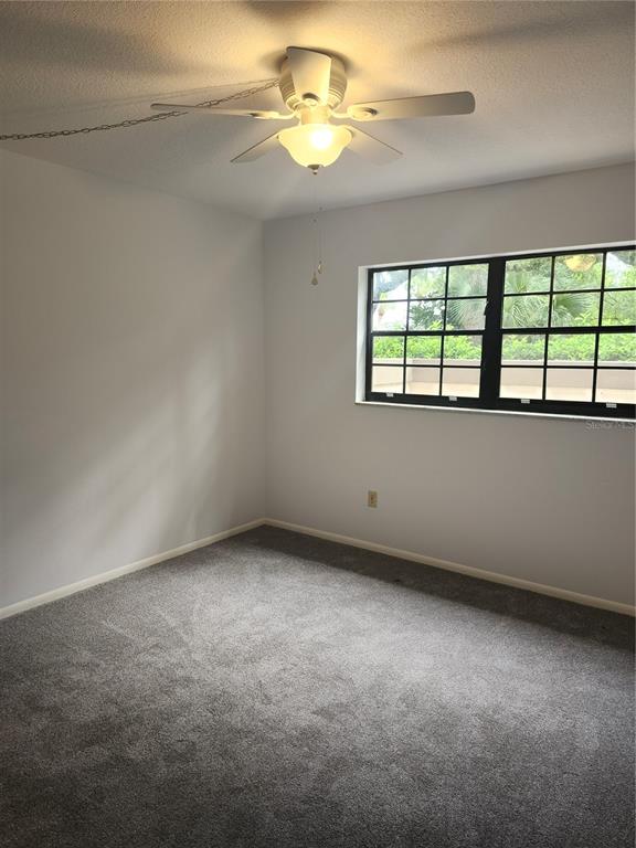 1515 Forrest Nelson Boulevard, Unit J104 Port Charlotte, FL 33952 - Photo 16 of 27 a view of an empty room with a window