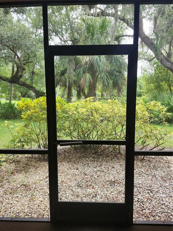 1515 Forrest Nelson Boulevard, Unit J104 Port Charlotte, FL 33952 - Photo 19 of 27 a view of a garden from a window