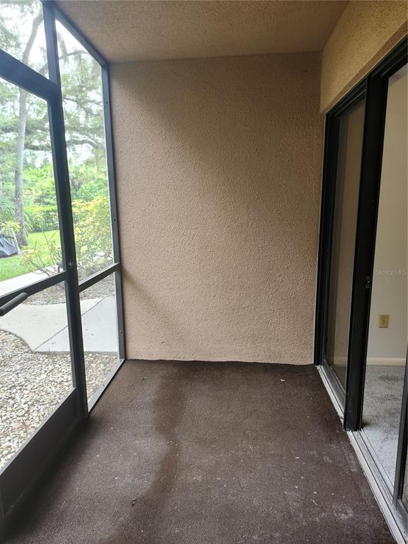 1515 Forrest Nelson Boulevard, Unit J104 Port Charlotte, FL 33952 - Photo 20 of 27 a view of empty room with window