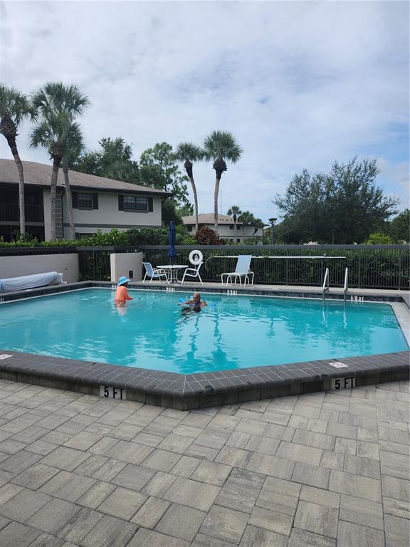 1515 Forrest Nelson Boulevard, Unit J104 Port Charlotte, FL 33952 - Photo 26 of 27 a view of a house with a yard