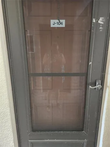 a bathroom with a glass shower door