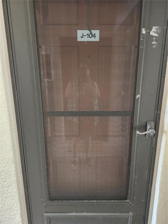 1515 Forrest Nelson Boulevard, Unit J104 Port Charlotte, FL 33952 - Photo 3 of 27 a bathroom with a glass shower door