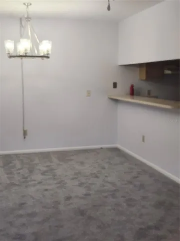 a kitchen with a sink cabinets and appliances