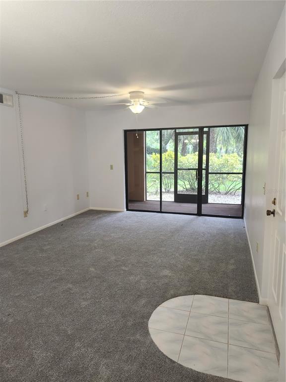 1515 Forrest Nelson Boulevard, Unit J104 Port Charlotte, FL 33952 - Photo 7 of 27 an empty room with windows