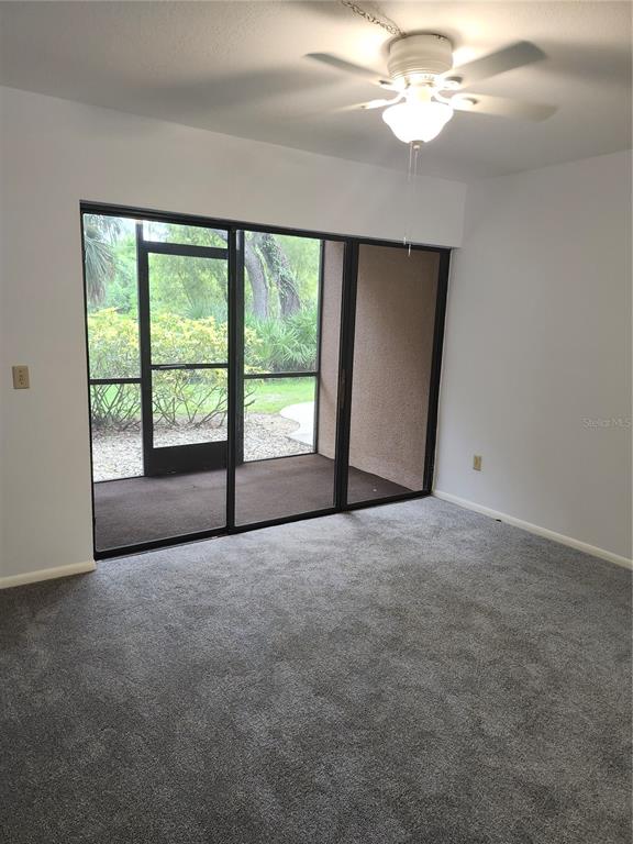 1515 Forrest Nelson Boulevard, Unit J104 Port Charlotte, FL 33952 - Photo 8 of 27 a view of an empty room with a window