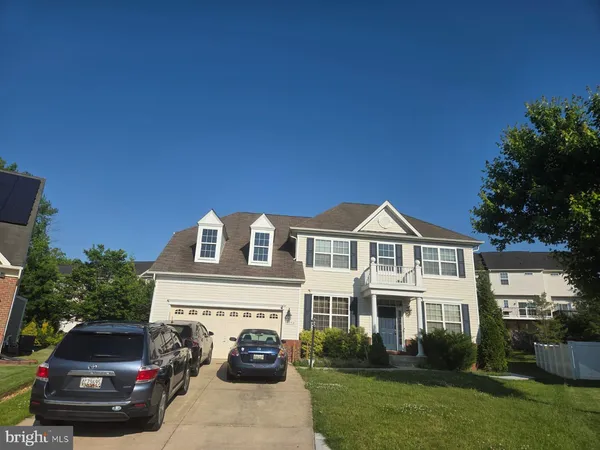 a car parked in front of a house