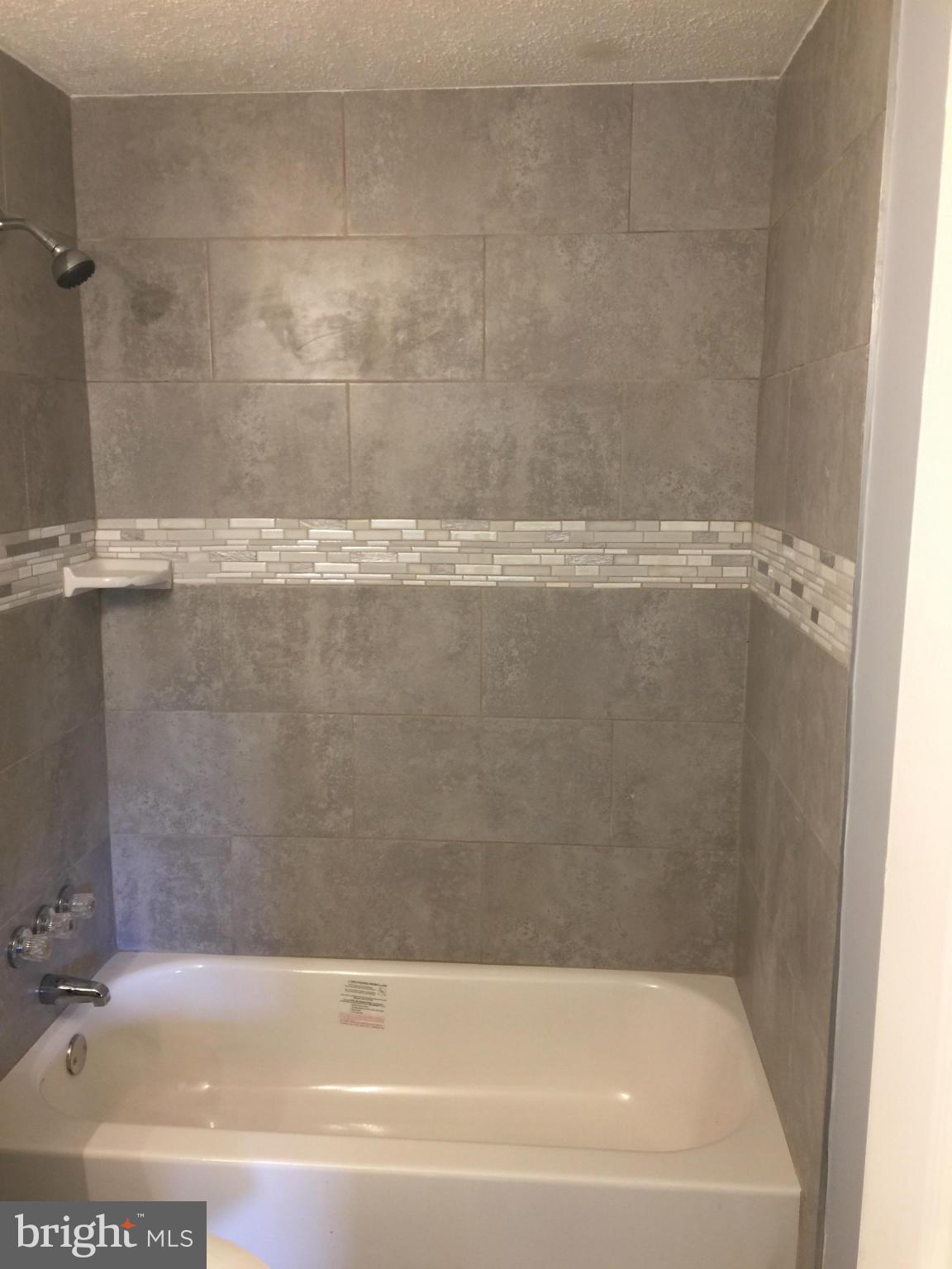 205 Biddle Road Accokeek, MD 20607 - Photo 12 of 24 a bathroom with a bathtub