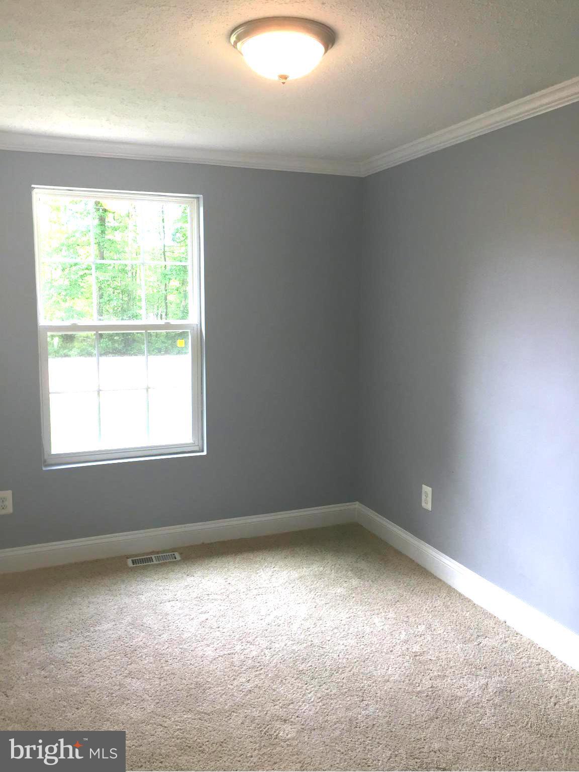 205 Biddle Road Accokeek, MD 20607 - Photo 15 of 24 an empty room with a window