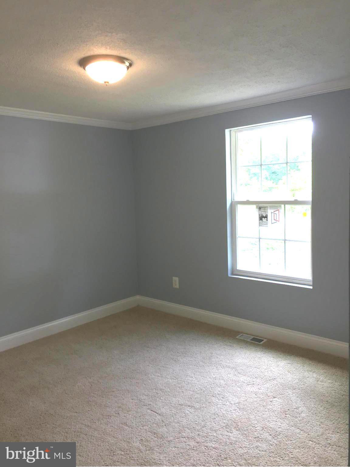 205 Biddle Road Accokeek, MD 20607 - Photo 16 of 24 an empty room with a window