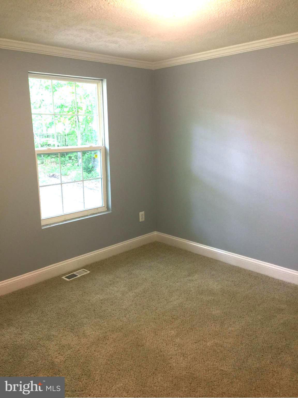 205 Biddle Road Accokeek, MD 20607 - Photo 17 of 24 an empty room with a window