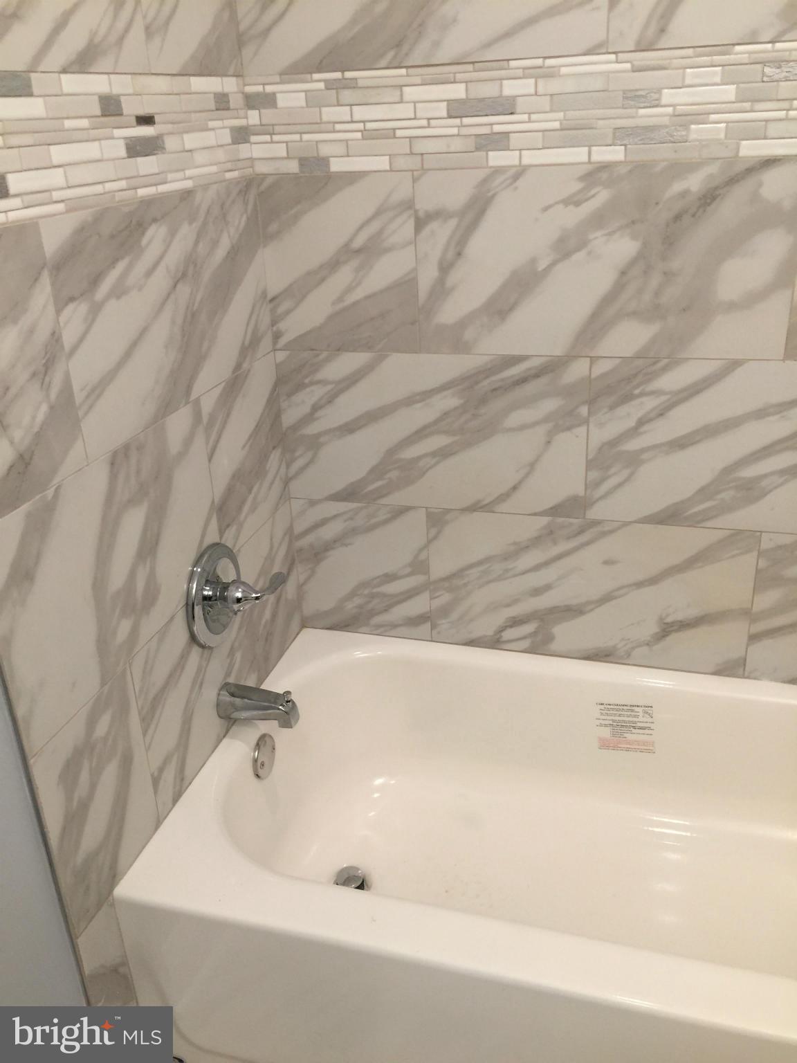 205 Biddle Road Accokeek, MD 20607 - Photo 10 of 24 a bathroom with a bathtub