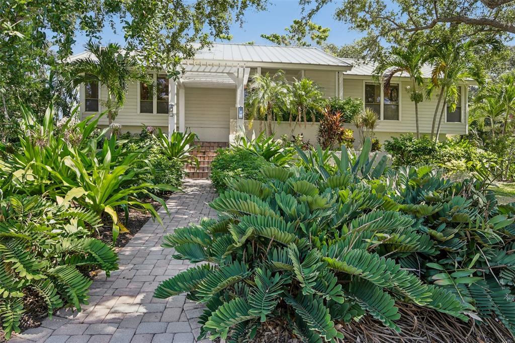 3390 Bayou Sound Longboat Key, FL 34228 - Photo 44 of 59 front view of a house with a yard