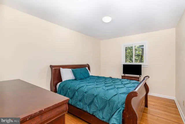 a bedroom with a bed and a table in it